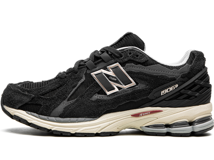 New Balance 1906D Protection Pack Black M1906DD SneakerMood Side view, toe pointing left
