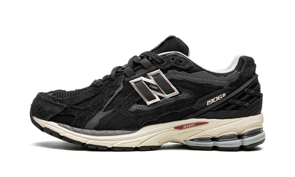 New Balance 1906D Protection Pack Black M1906DD SneakerMood Side view, toe pointing left