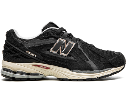 New Balance 1906D Protection Pack Black M1906DD SneakerMood Side view, toe pointing right