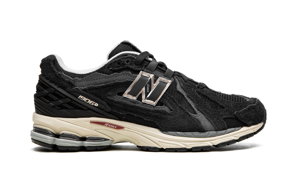 New Balance 1906D Protection Pack Black M1906DD SneakerMood Side view, toe pointing right