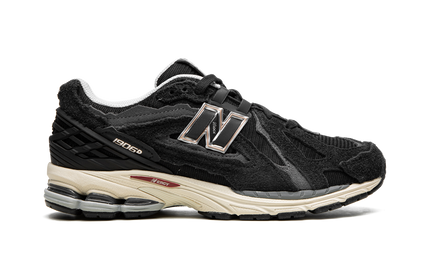 New Balance 1906D Protection Pack Black M1906DD SneakerMood Side view, toe pointing right