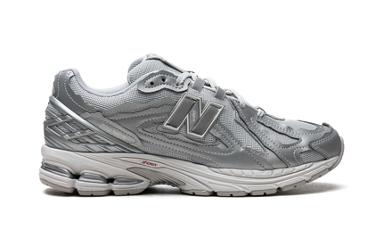 New Balance 1906D Protection Pack Silver Metallic M1906DH SneakerMood Side view, toe pointing right