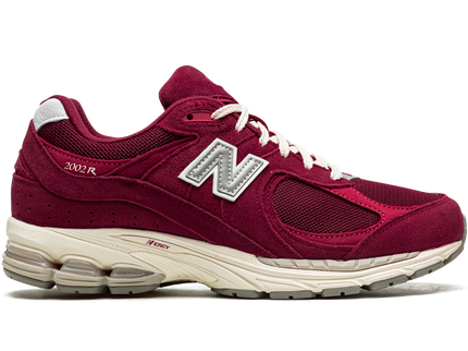 New Balance 2002R Bordeaux M2002RHA SneakerMood Side view, toe pointing right