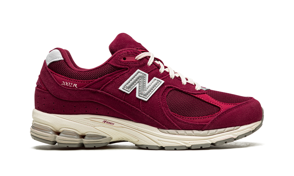 New Balance 2002R Bordeaux M2002RHA SneakerMood Side view, toe pointing right