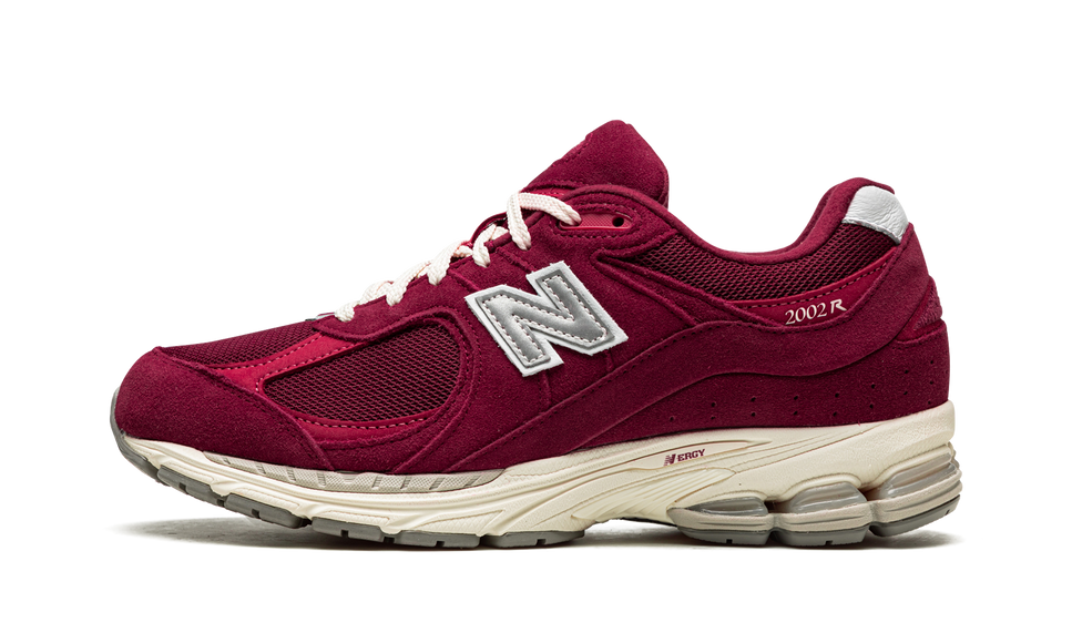 New Balance 2002R Bordeaux M2002RHA SneakerMood Side view, toe pointing left