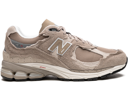 New Balance 2002R Protection Pack Driftwood M2002RDL SneakerMood Side view, toe pointing right