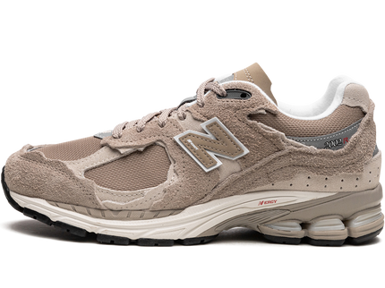 New Balance 2002R Protection Pack Driftwood M2002RDL SneakerMood Side view, toe pointing left