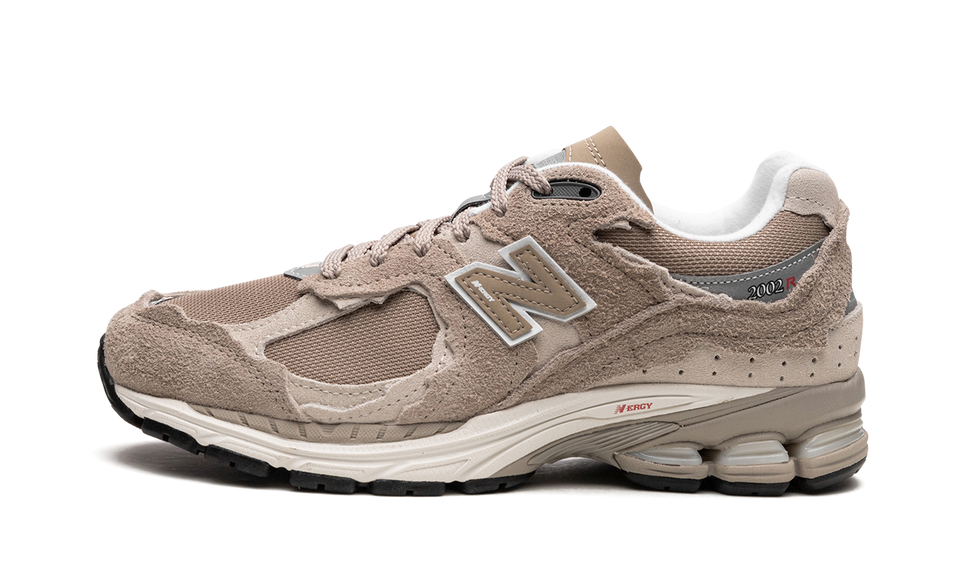 New Balance 2002R Protection Pack Driftwood M2002RDL SneakerMood Side view, toe pointing left
