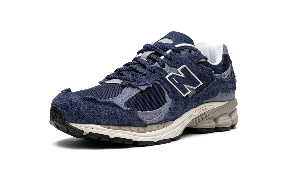 New Balance 2002R Protection Pack Navy Grey M2002RDK SneakerMood Front three-quarter view