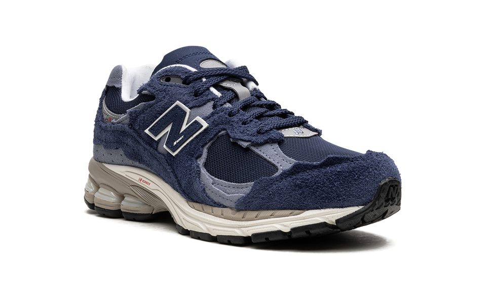 New Balance 2002R Protection Pack Navy Grey M2002RDK SneakerMood Front three-quarter view