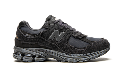 New Balance 2002R Protection Pack Phantom M2002RDB SneakerMood Side view, toe pointing right