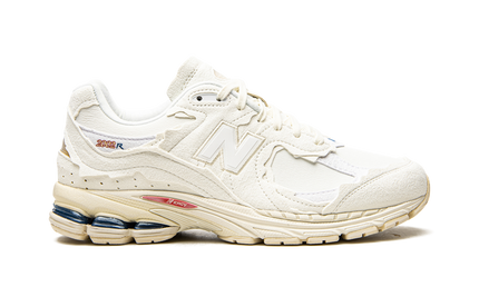 New Balance 2002R Protection Pack Sea Salt M2002RDC SneakerMood Side view, toe pointing right